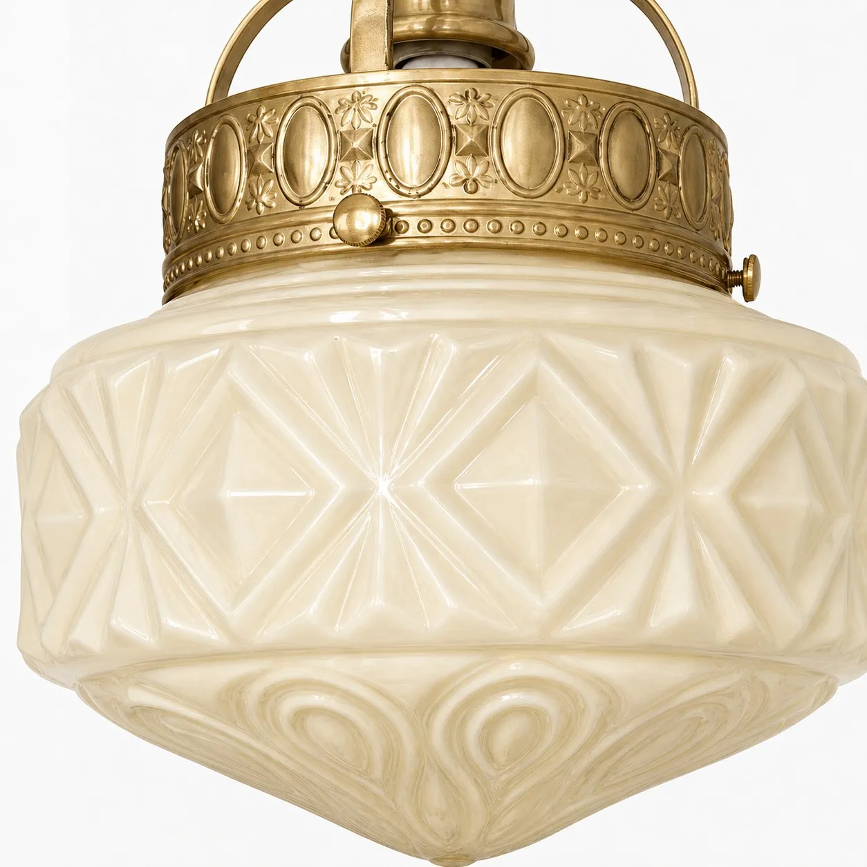Embossed milk glass shade and brass pendant band detail
