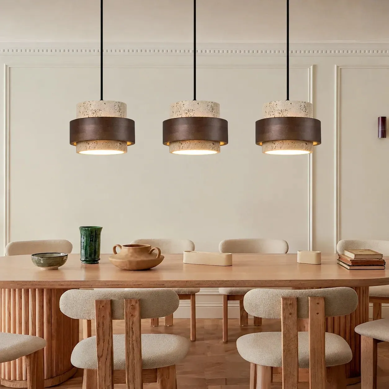 Three pendants over a wood dining table