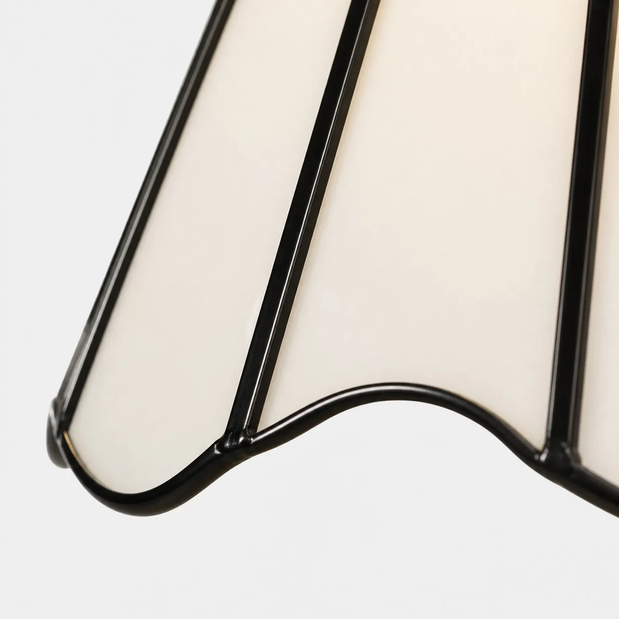 Scalloped glass shade edge with black trim