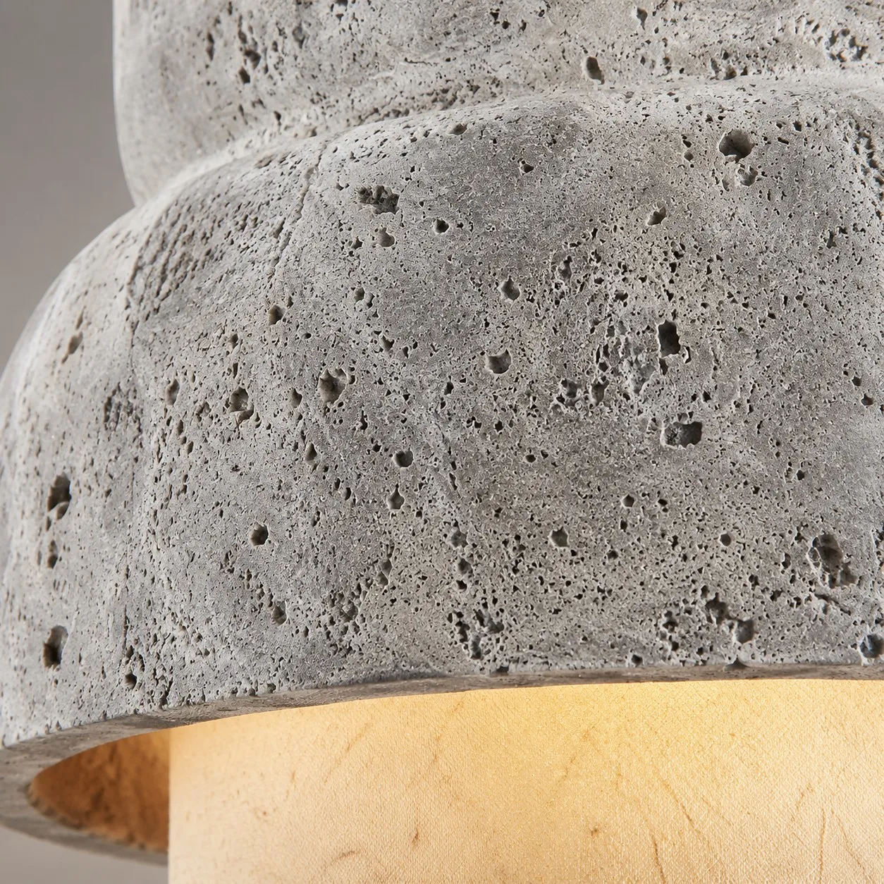 Macro close-up of porous gray travertine stone texture