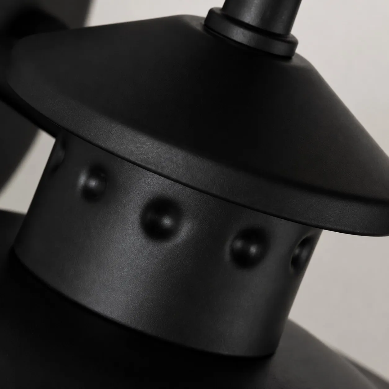 Black riveted metal cap detail
