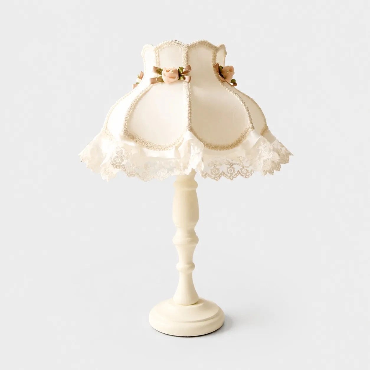 Ivory cotton brocade lace table lamp on a light background